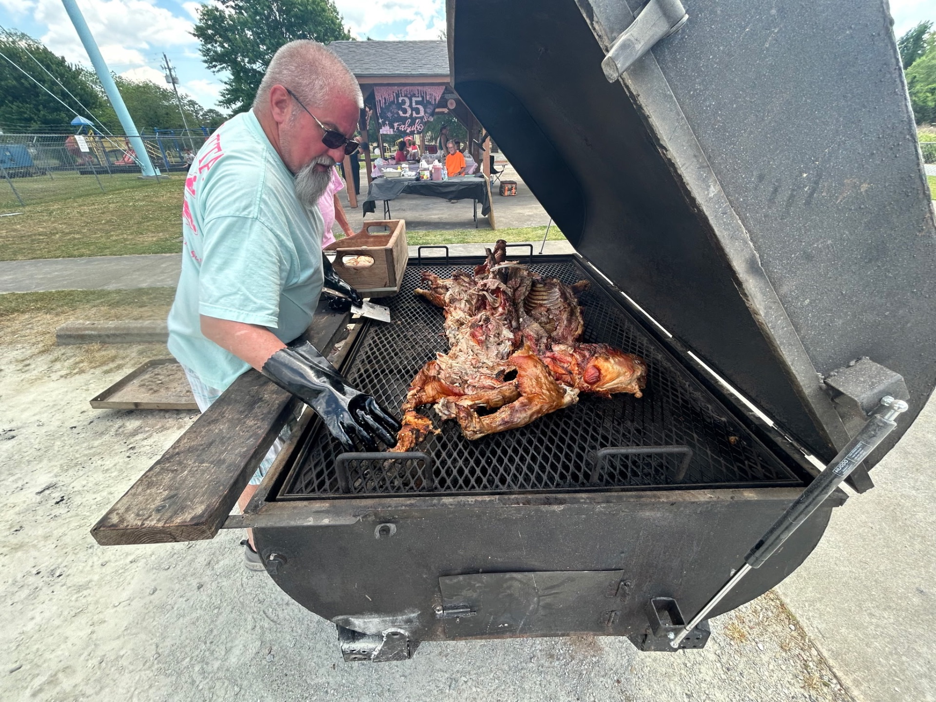 Pig cooker in action smoking a whole hog